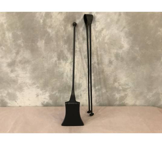 A blackened iron chimney with a shovel and a clamp 18 th