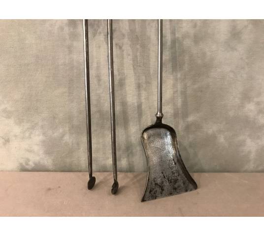 Beautiful chimney set with a shovel and an iron clamp and silver bronze of epoch 19 th