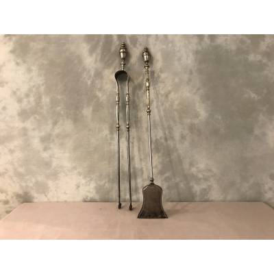 Beautiful chimney set with a shovel and an iron clamp and silver bronze of epoch 19 th