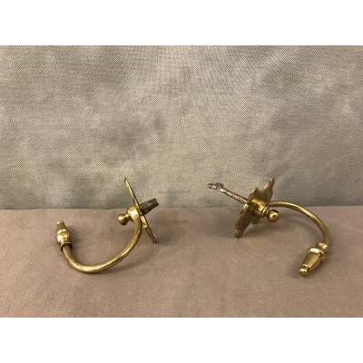 Pair of brass fireplace hooks from the 19th century