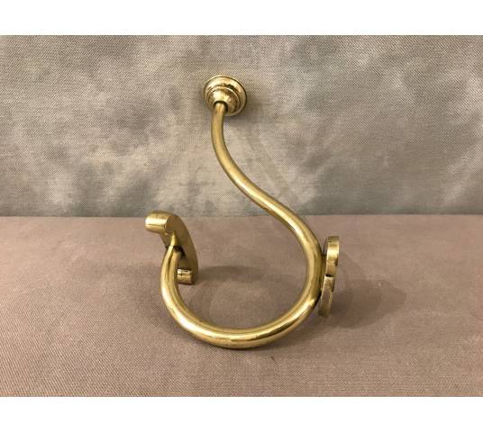 Coat hook, polished and varnished brass coat rack from the 19th century