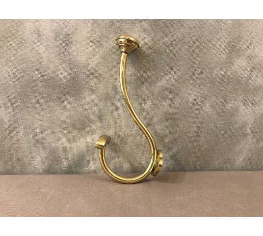 Coat hook, polished and varnished brass coat rack from the 19th century