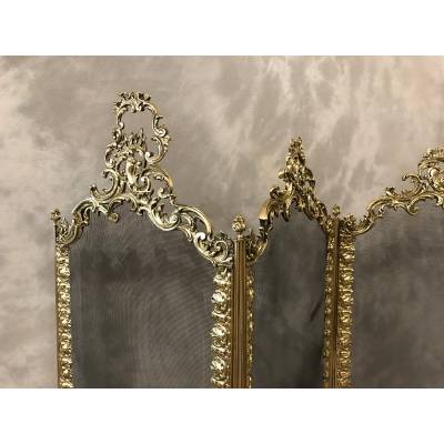 Beautiful old fireplace firewall in bronze and brass from the 19th century