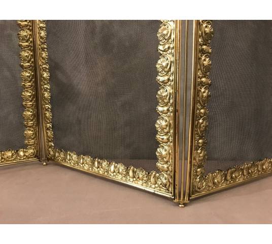 Beautiful old fireplace firewall in bronze and brass from the 19th century