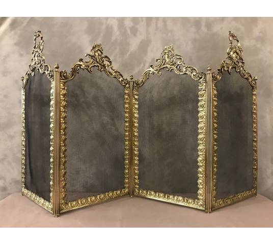 Beautiful old fireplace firewall in bronze and brass from the 19th century