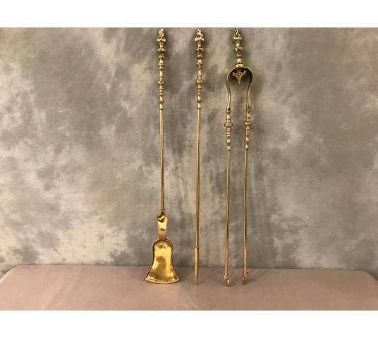 Set of 3 pieces of bronze and brass fireplace accessories from the 19th century