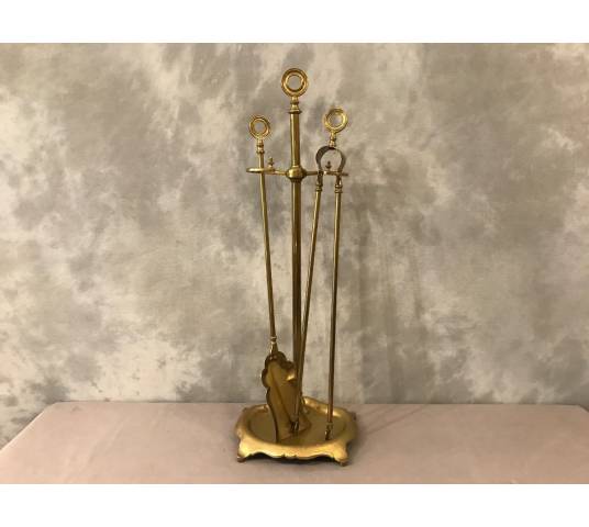 Old brass fireplace servant from the 19th century