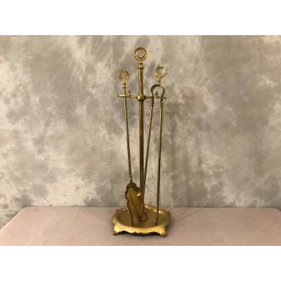 Old brass fireplace servant from the 19th century