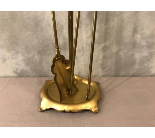 Old brass fireplace servant from the 19th century