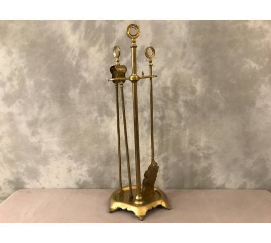 Old brass fireplace servant from the 19th century