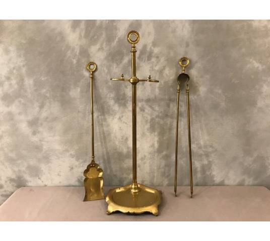 Old brass fireplace servant from the 19th century