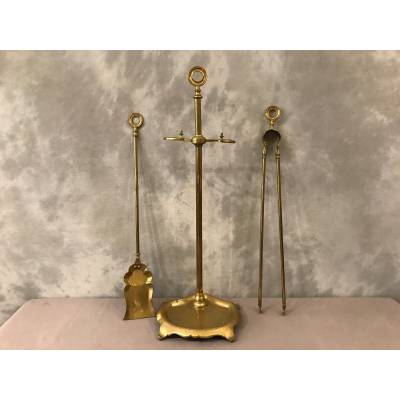 Old brass fireplace servant from the 19th century