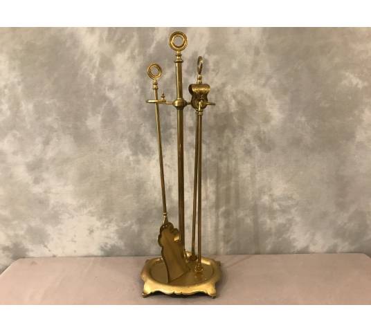 Old brass fireplace servant from the 19th century