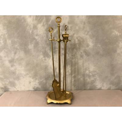 Old brass fireplace servant from the 19th century