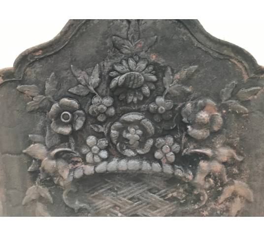 Old cast iron fireplace plate from the 19th century