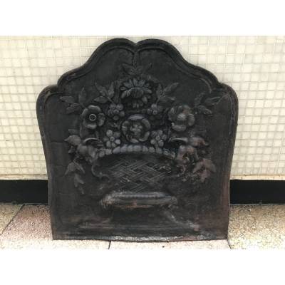 Old cast iron fireplace plate from the 19th century