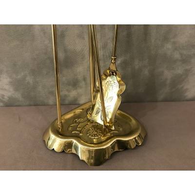 Old brass fireplace servant from the 19th century