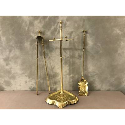 Old brass fireplace servant from the 19th century