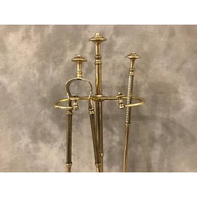 Old brass fireplace servant from the 19th century