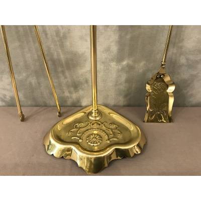 Old brass fireplace servant from the 19th century