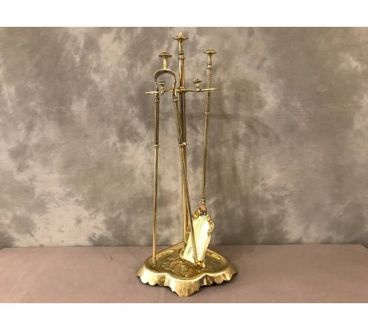 Old brass fireplace servant from the 19th century