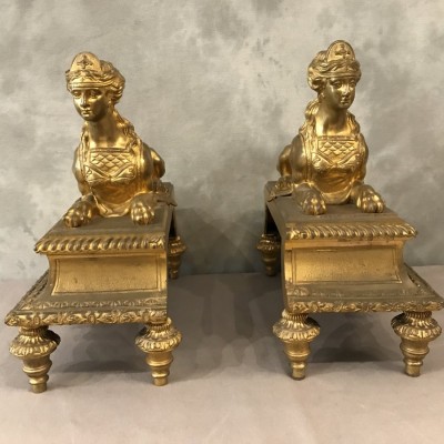 Paire de chenets en bronze doré aux sphinx d'époque 19 ème