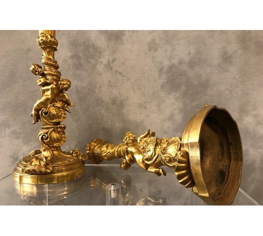 Ravant pair of torches of time 18th Louis XV in gilded bronze